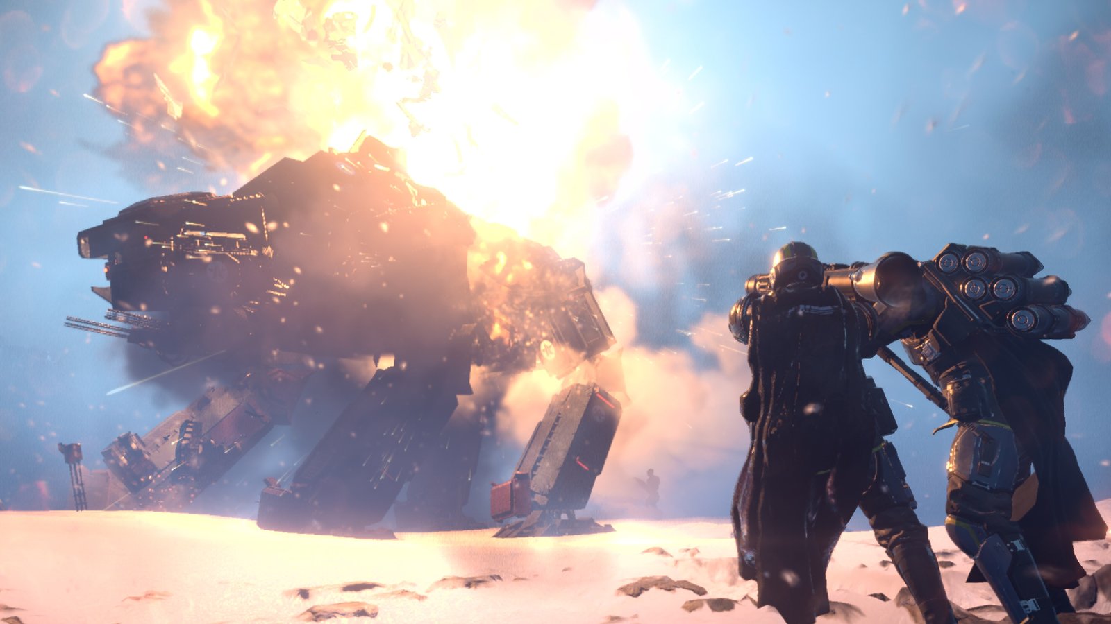 A Factory Strider buckles in a fireball on a snowy plain while two Helldivers, one wearing a missile backpack, watch