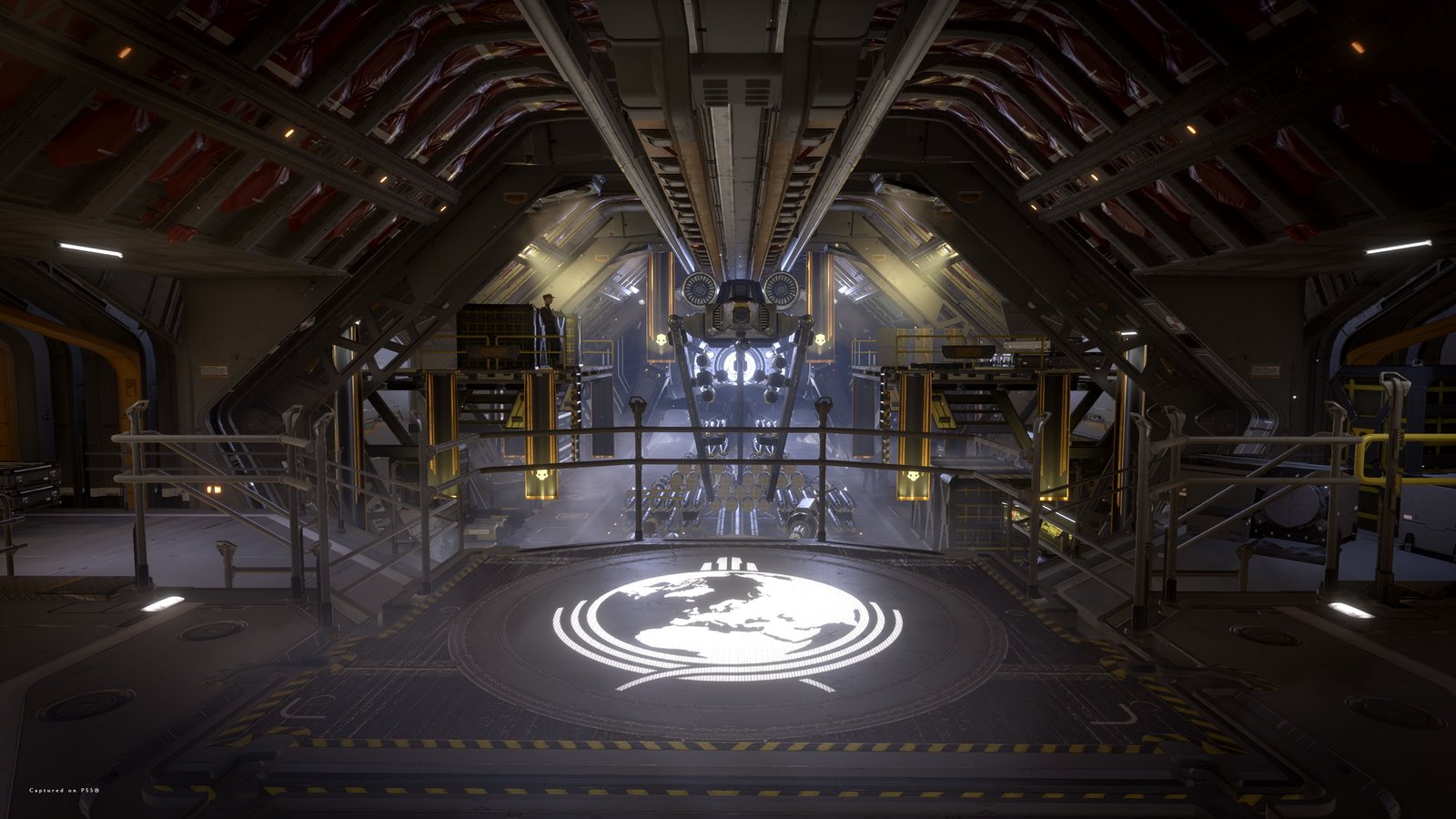 The hellpod launch bay aboard a Super Destroyer, seen from a railed platform with a glowing globe emblem on its floor